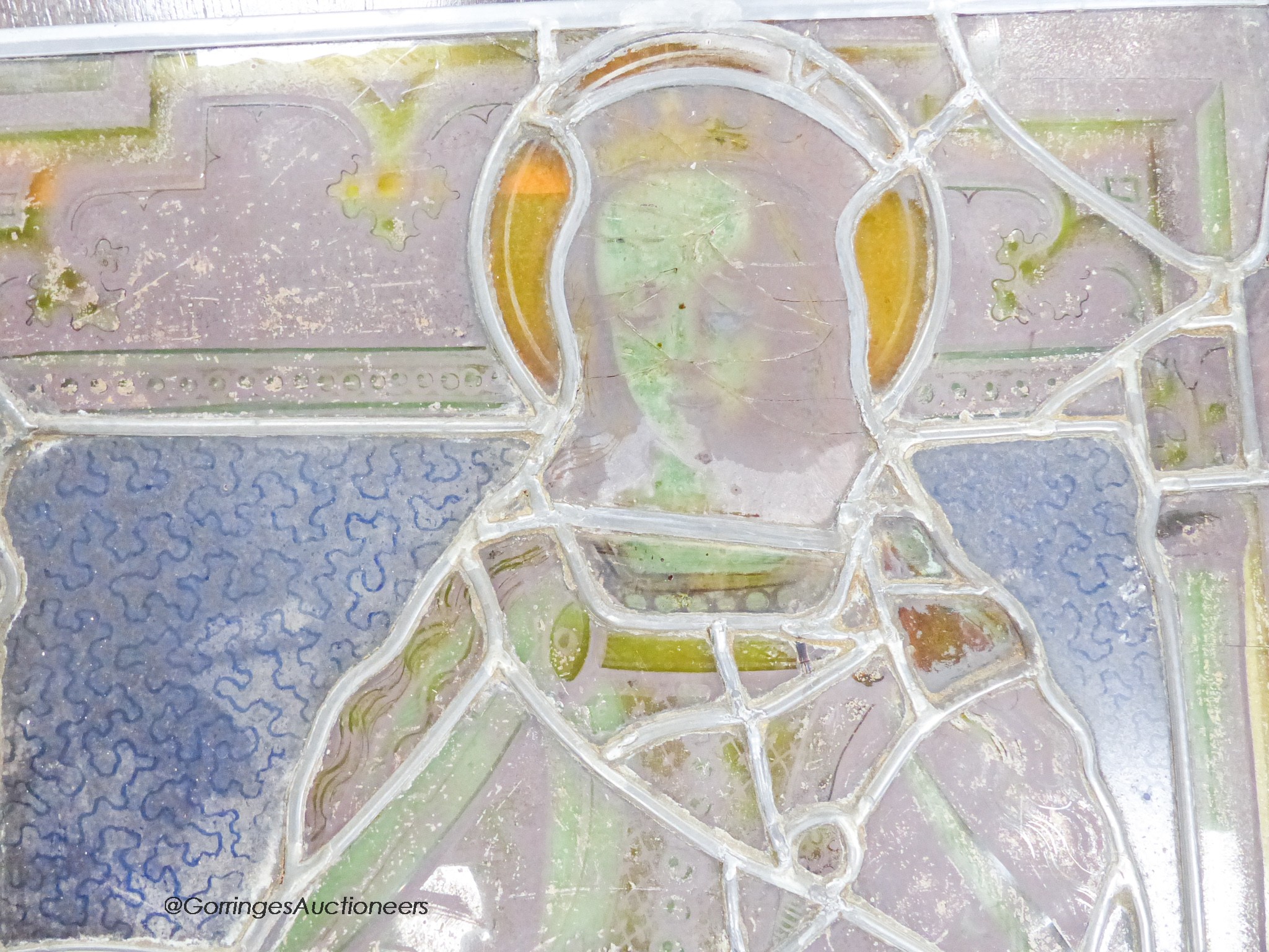 An early 16th century German stained leaded glass panel, depicting St. Catherine holding a sword and a book. 25 x 17.5ins. (later restorations and replacements)